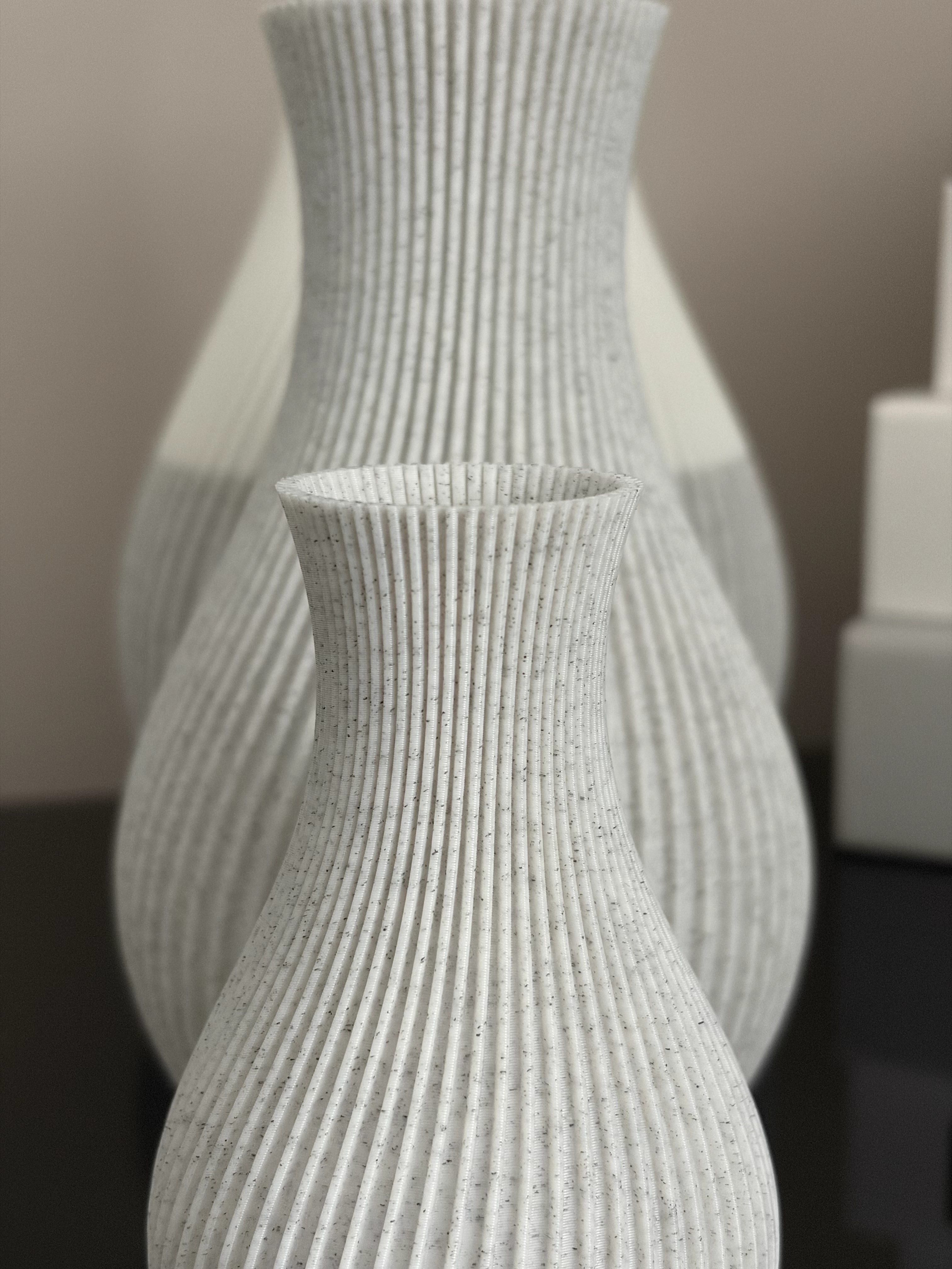 Close-up of a Marble Pleat vessel, showing the fine printed ridges and speckled finish