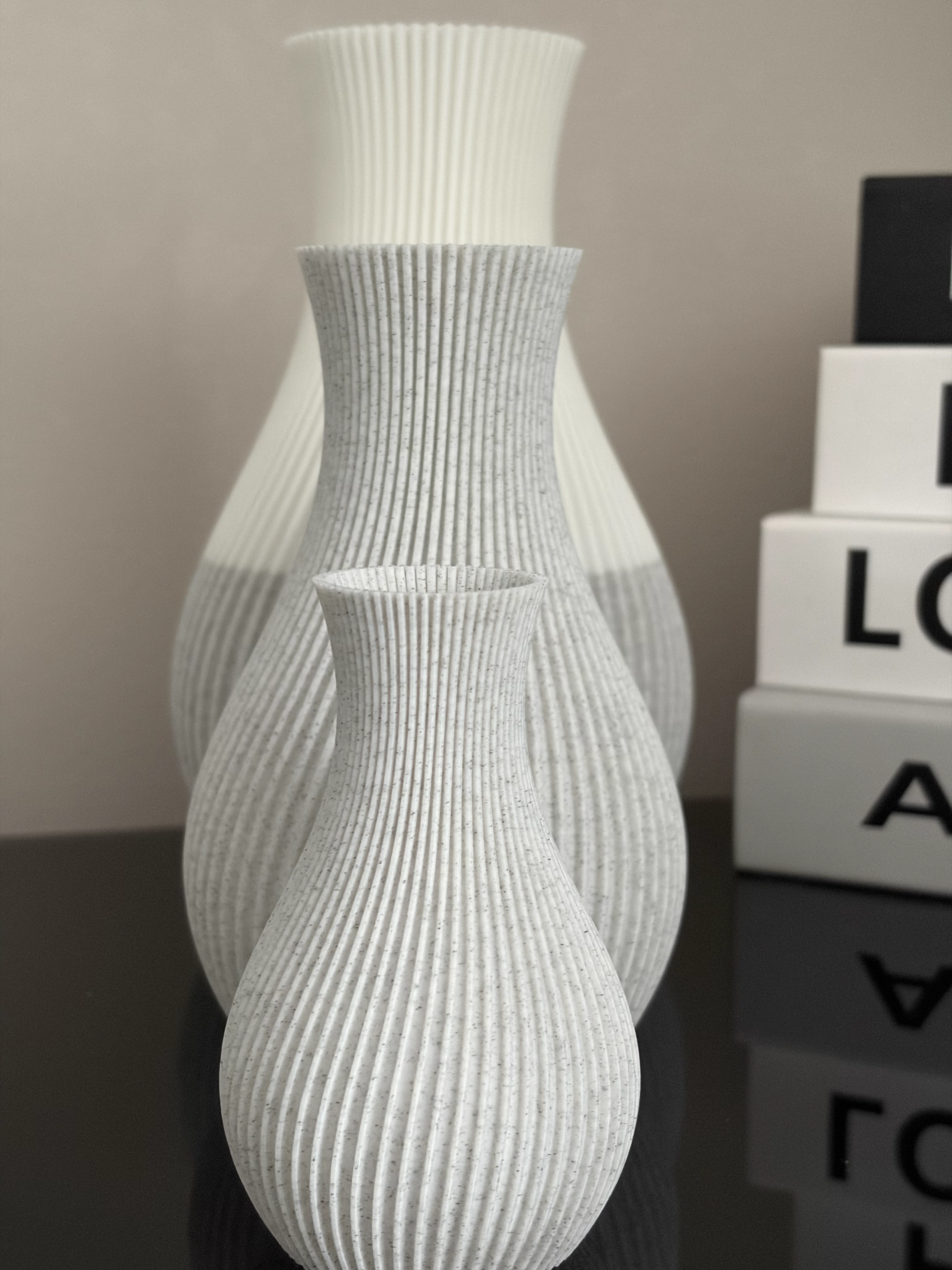 Three Marble Pleat vessels arranged from small to large